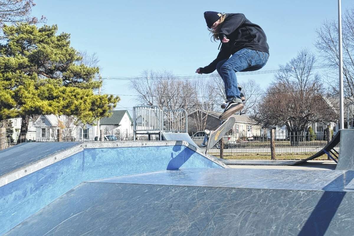 Ty Broyles of Jacksonville took advantage of Wednesday’s unseasonably warm weather to practice a skateboarding trick at the skate park in Community Park.