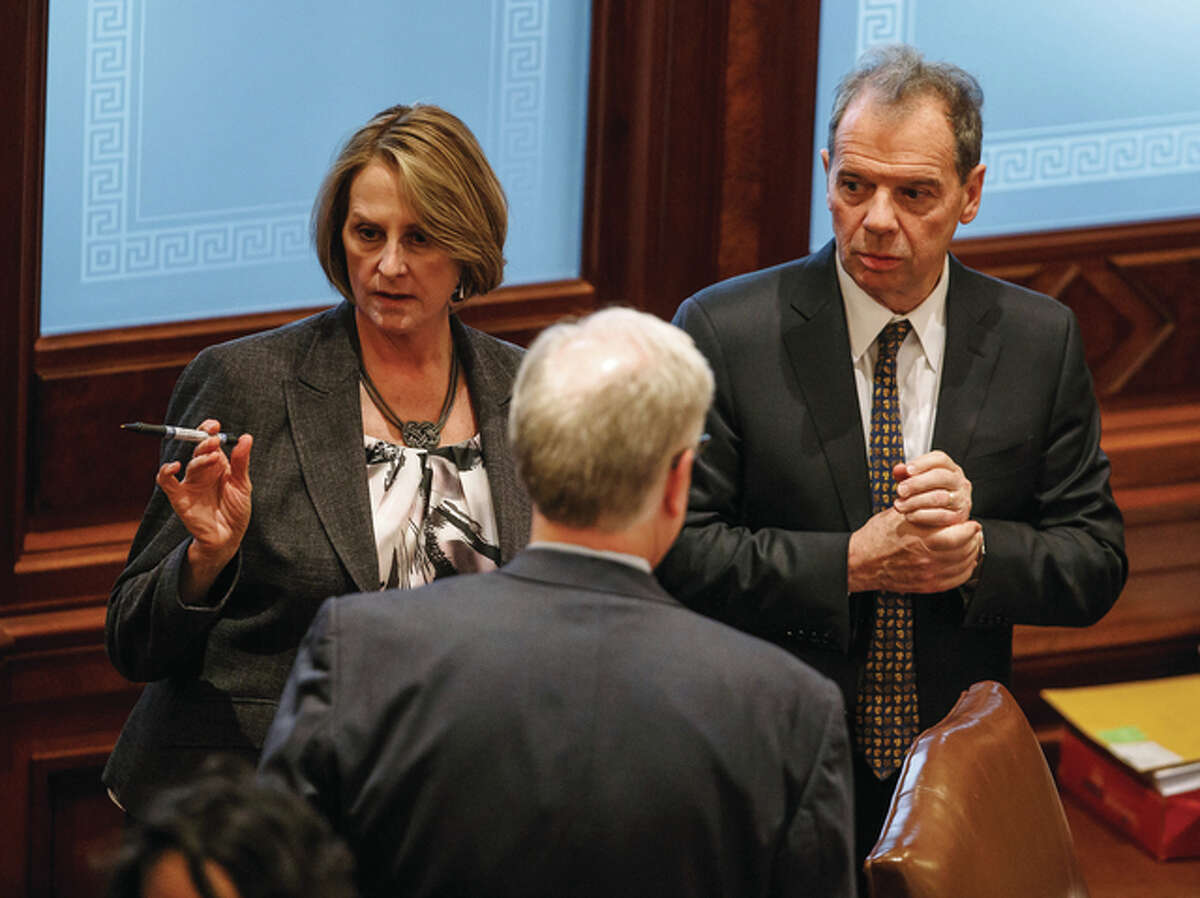 Justin L. Fowler | State Journal-Register (AP) Senate Minority Leader Christine Radogno (left), R-Lemont, talks with Senate President John Cullerton (right), D-Chicago, at the Capitol in Springfield. The Senate leaders are sticking to their work that they plan to vote on a compromise budget deal Wednesday.