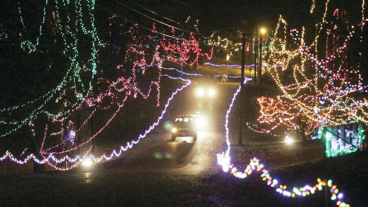 Vehicles head toward the exit of Christmas Wonderland, the annual holiday light display at Rock Spring Park in Alton.