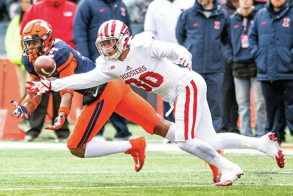 Indiana defensive back Chase Dutra (30) defends a pass intended for Illinois tight end Louis Dorsey (19) and is called for pass interference in last week’s Illini home loss to the Hoosierts. Illinois will play at Ohio State Saturday.