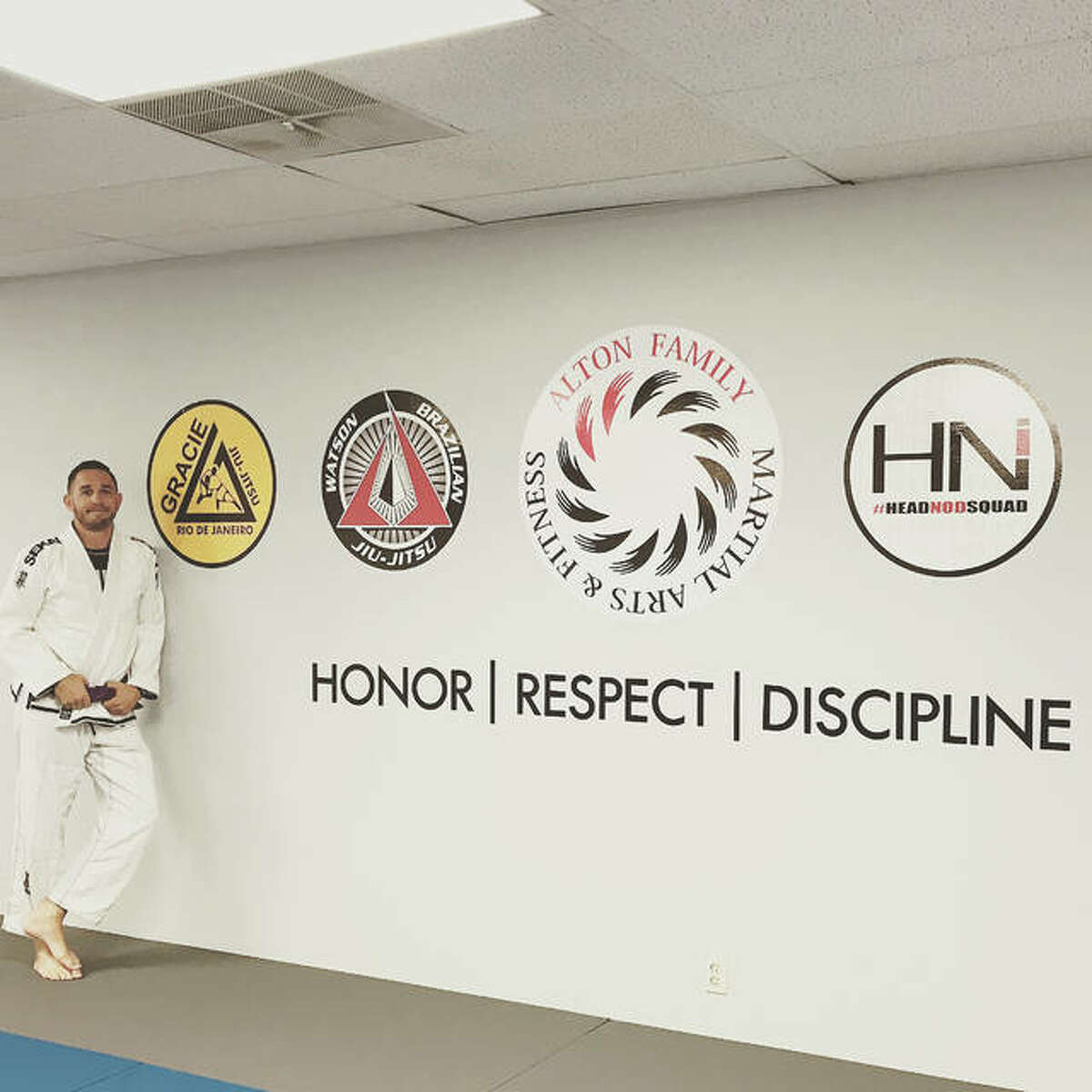 Alton Family Martial Arts and Fitness owner Adam Marburger stands in his newly-renovated space at Nautilus Fitness Center in Alton. Marburger hopes to improve lives through the discipline of martial arts.