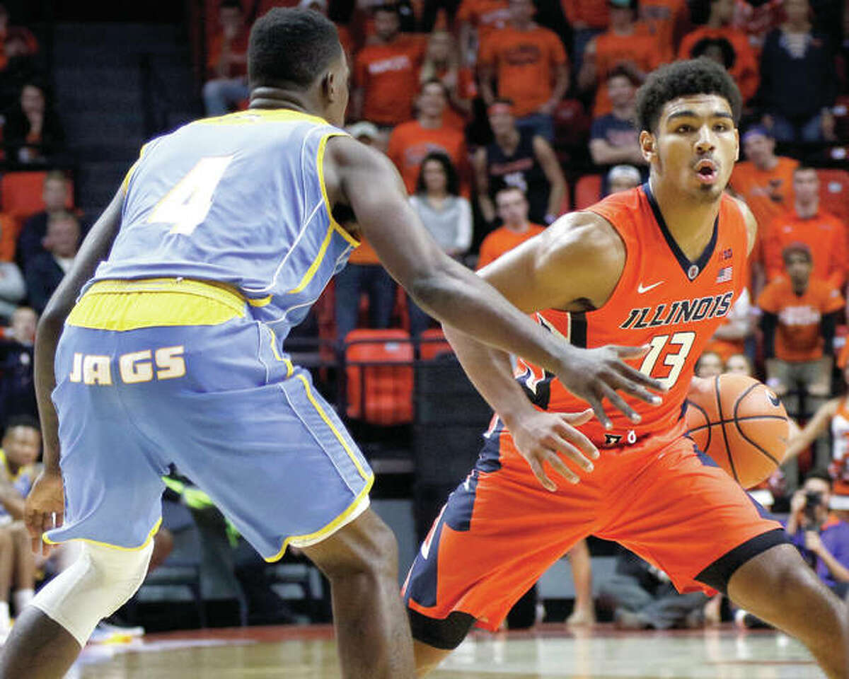 Illinois’ Mark Smith (right), a freshman from Edwardsville, handles the ball against defensive pressure from Southern University’s Chris Thomas during an Illini win Nov. 10 at State Farm Center in Champaign.