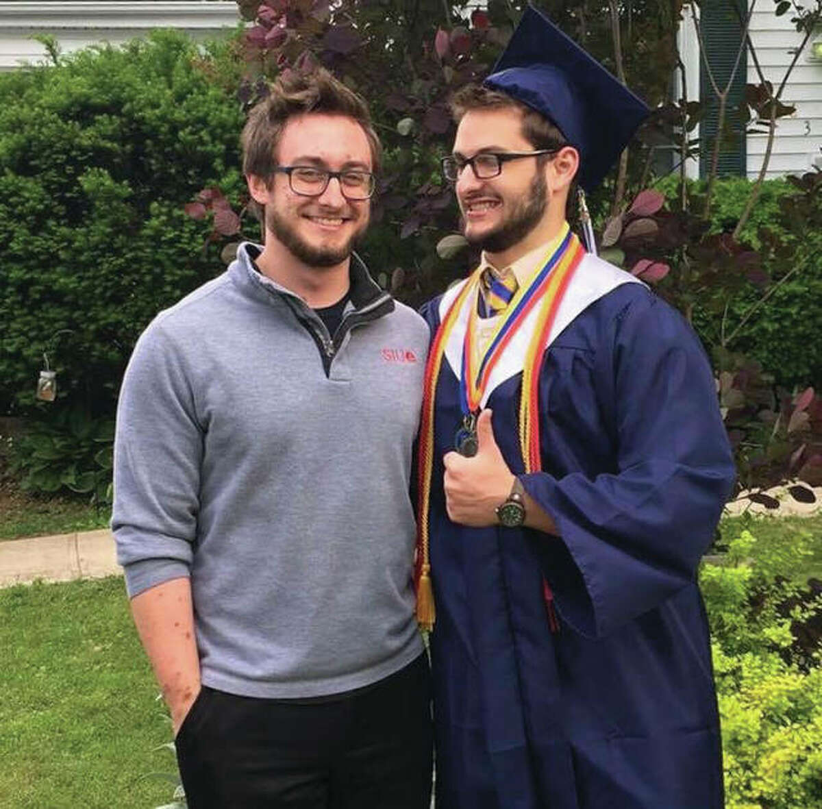 Spencer Bacus, left, with his brother, Oliver Bacus, on Oliver’s graduation day.