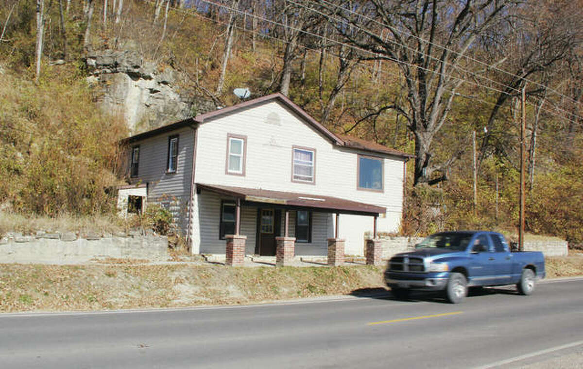 A Grafton house on Highway 100, formerly owned by Joanne Groves, awaits demolition. The house, which was struck by a large mudslide in late 2015, was recently turned over to the city of Grafton as part of a lawsuit settlement.