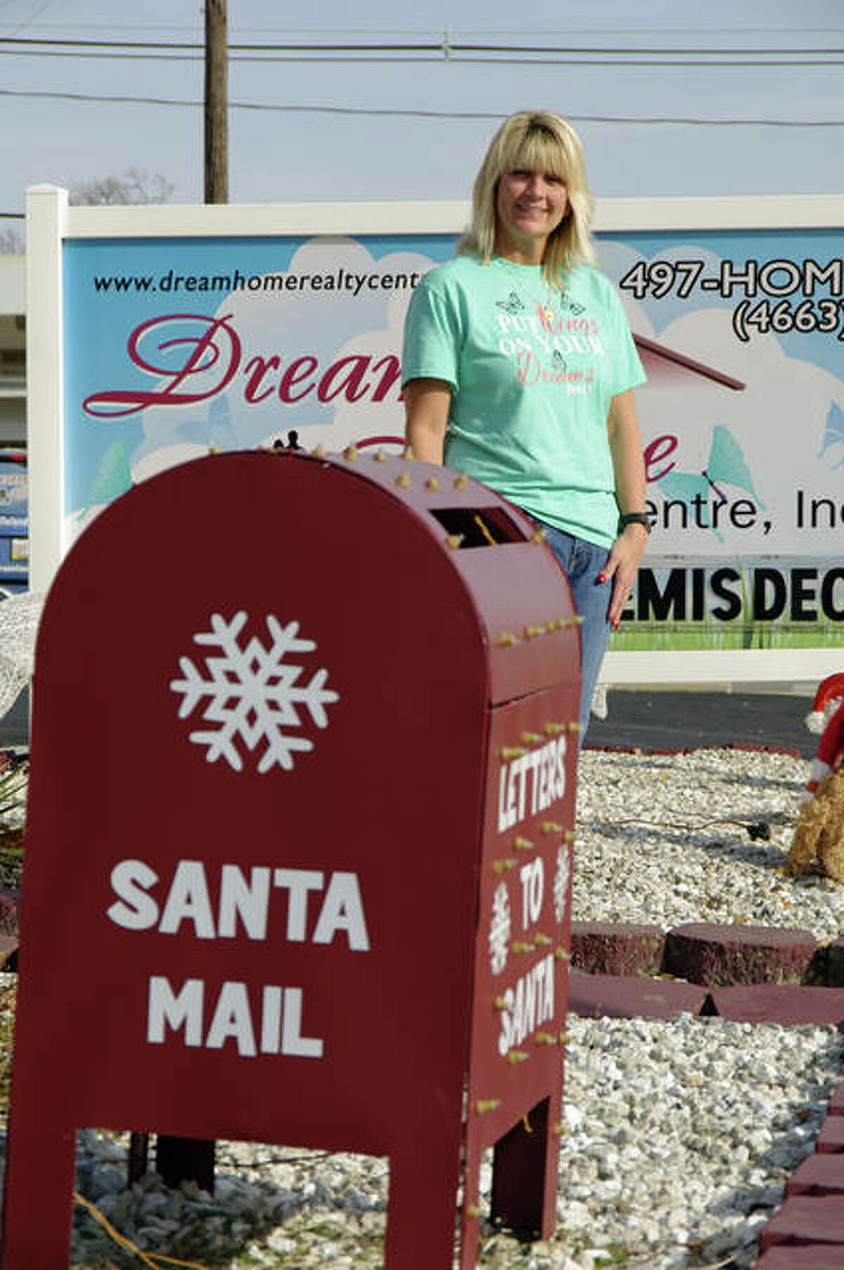 Fill Santa’s Semis event organizer Sherry Gilleland at Dream Home Charities headquarters in Wood River.