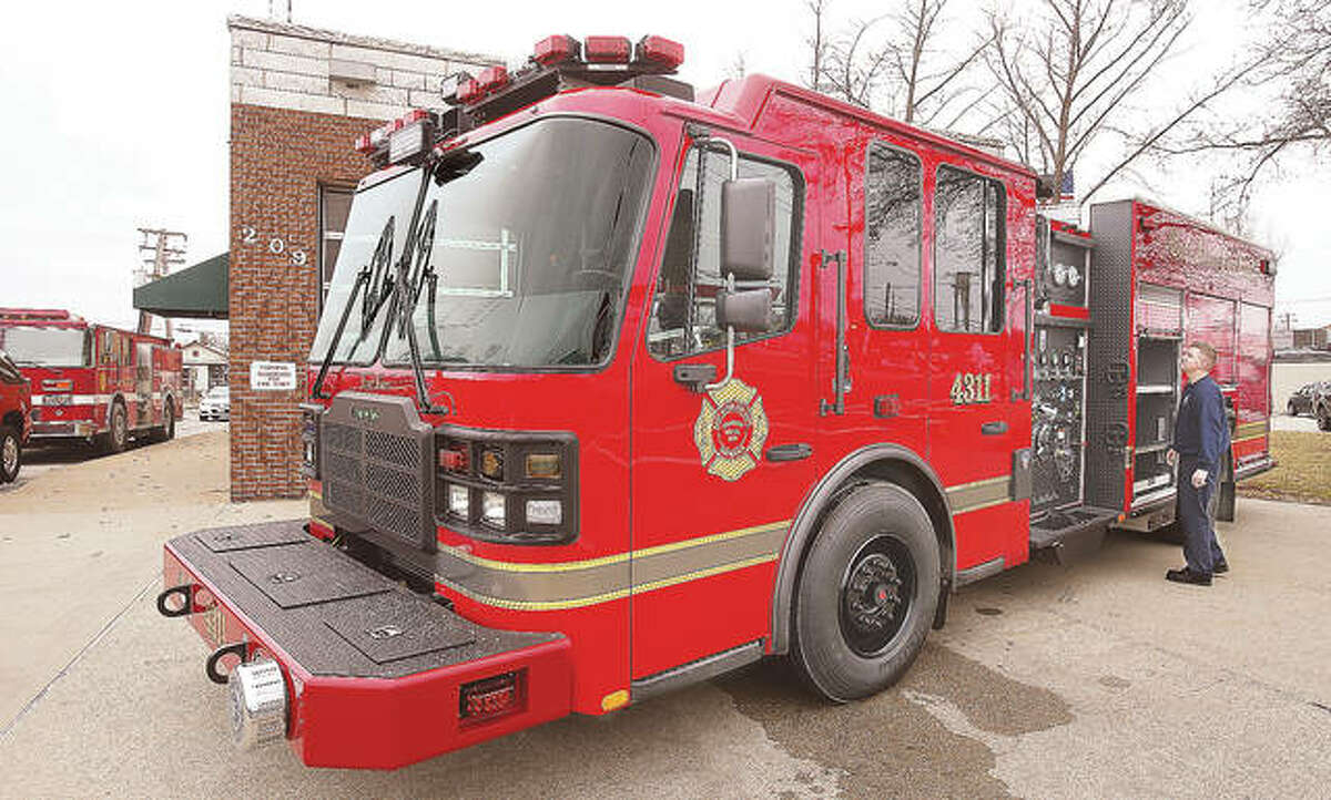 In this photo from January, East Alton firefighters get acquainted with their brand new Ferrara Fire Apparatus rescue-pumper style truck. It replaced a 20-year-old Pierce built truck, left, which has since been in storage. Now, the village has approved the purchase of equipment for the new truck that will allow for the Pierce pumper to exist as a reserve, the first time in a long time — possibly ever — the village has had a reserve pumper.