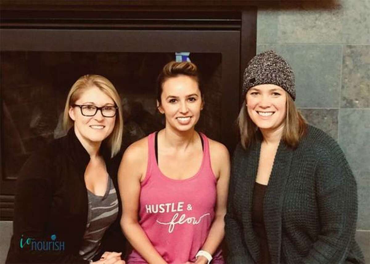 Iron Orchid Studio owners Christal Laswell, left, and Bree Barnes with nutrionist Kelsey Albers.
