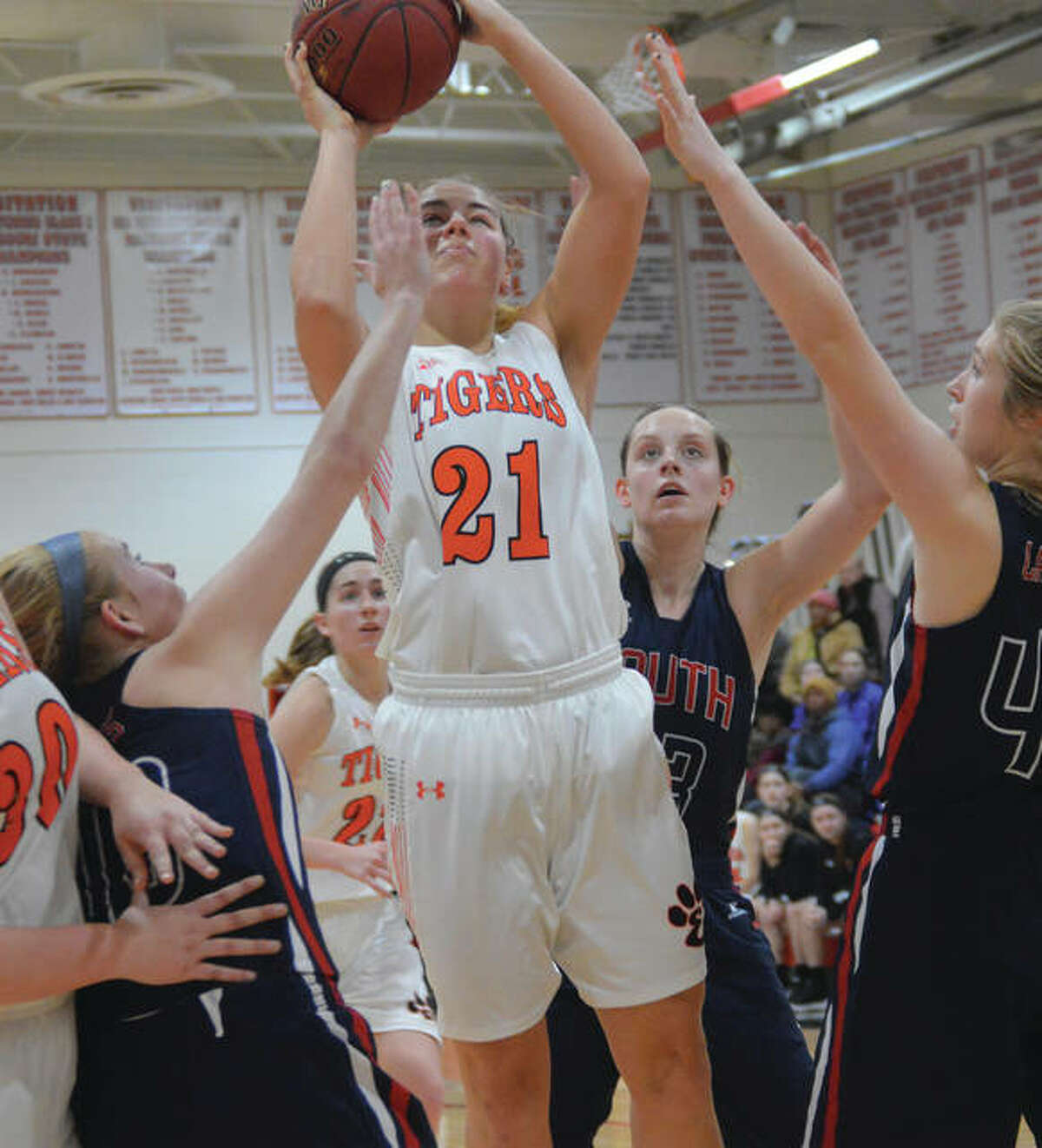 Edwardsville’s Rachel Pranger (21) goes up in traffic for a shot during a first-round game Saturday against Parkway South in the Visitation Tournament in St. Louis. The Tigers were back at Viz on Tuesday and got 16 points in a 61-23 quarterfinal victory over Washington, Mo.
