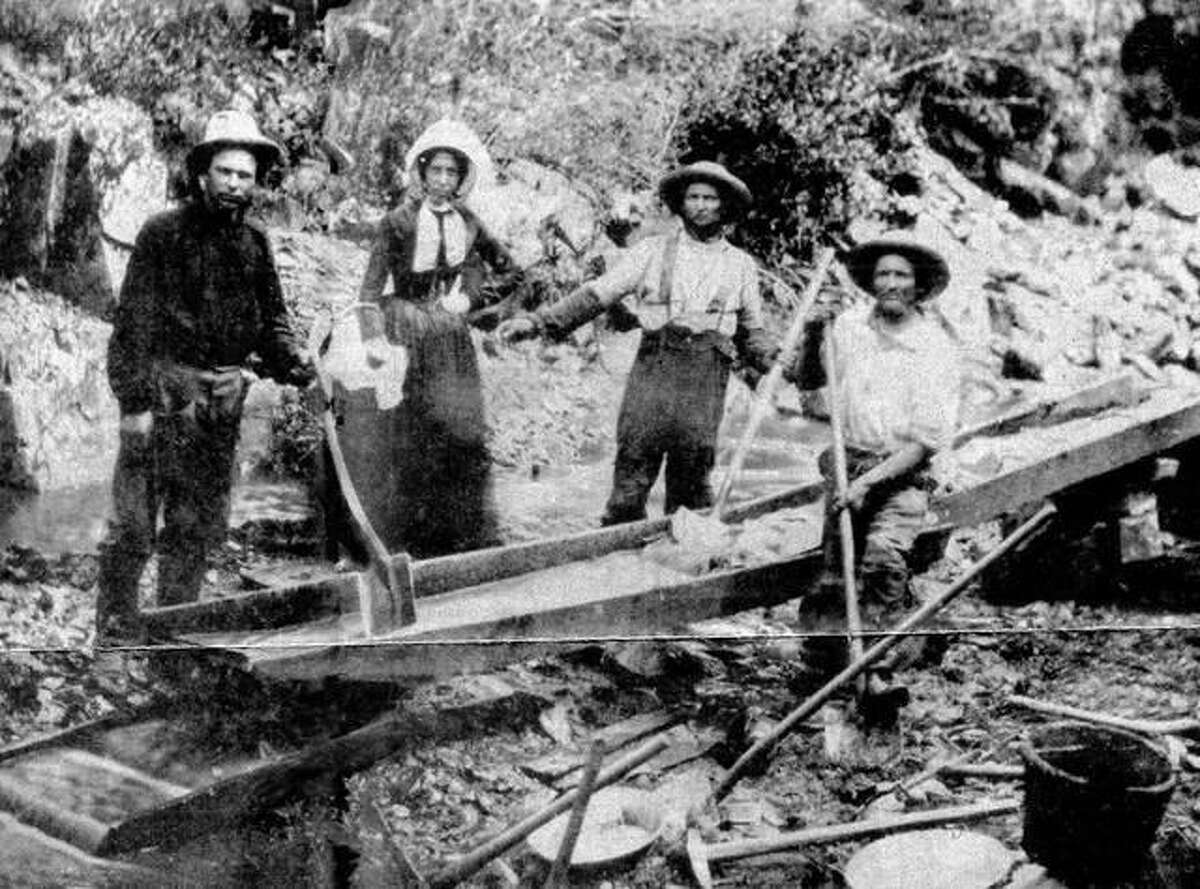Prospectors look for gold in a California stream in the mid-1800s.
