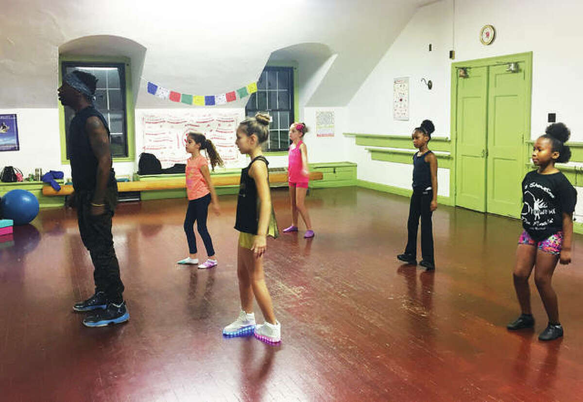 Dominique Williams leads a hip-hop class in M & M Showtime Productions’ studio at the YWCA of Alton. Meghan McAfoos owns and teaches at M & M Showtime Productions, now located in the YWCA of Alton building on Third Street.