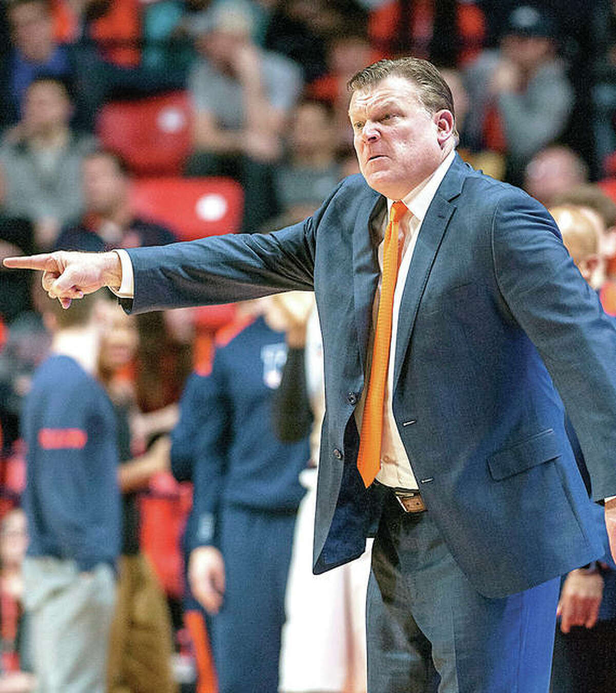 Illinois coach Brad Underwood motions to his players during Thursday night’s game against Iowa in Champaign.