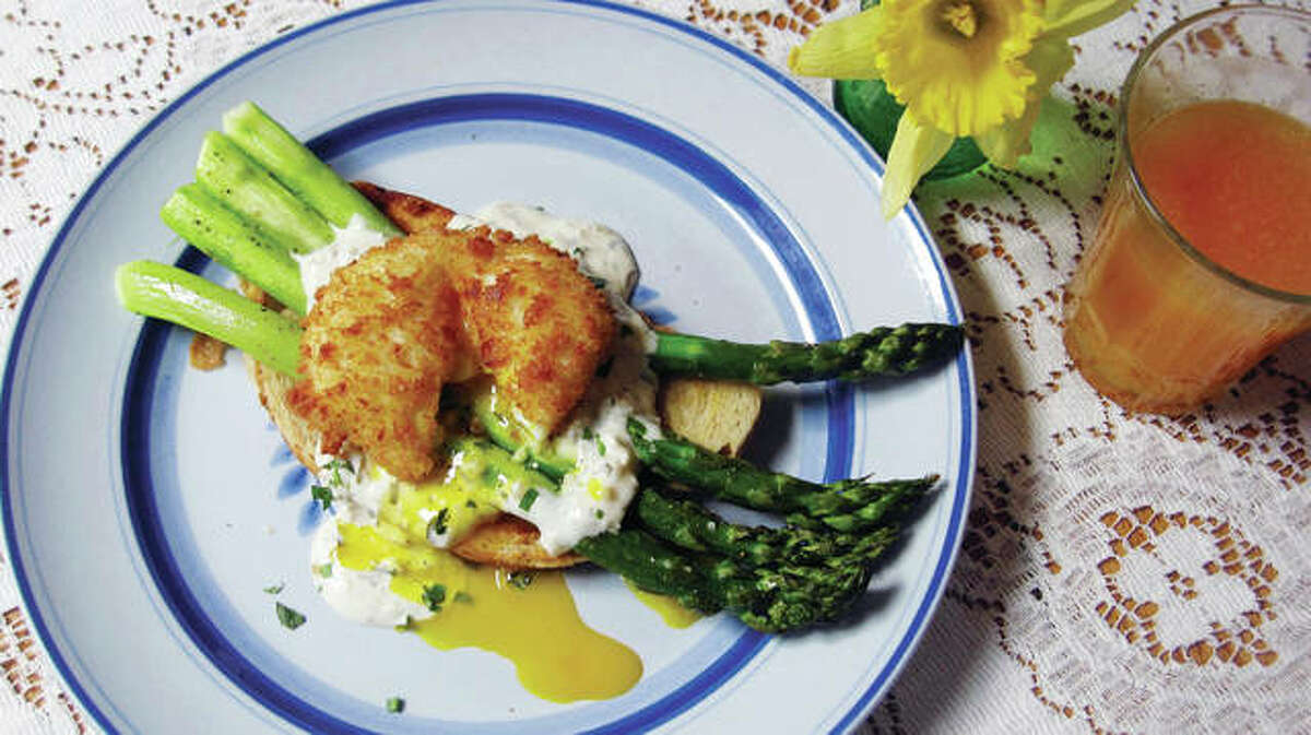 Roasted asparagus toast starts with a base of artisanal toast brushed with olive oil. It is topped with roasted asparagus and a poached egg that is then carefully breaded and deep-fried. (Sara Moulton via AP)
