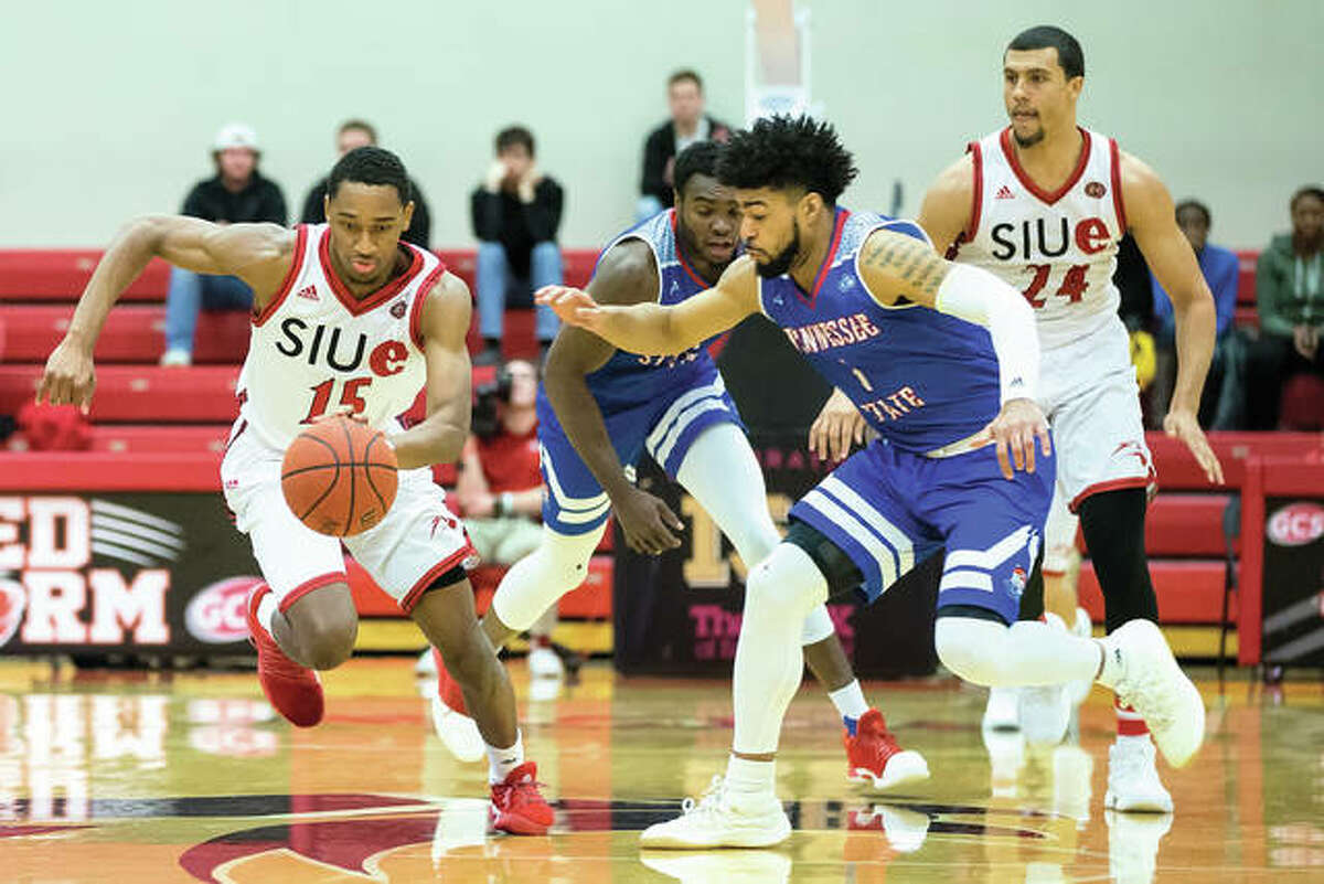 SIUE’s David McFarland (left) pushes the ball upcourt ahead of Tennessee State’s Delano Spencer on Saturday night at Vadalabene Center in Edwardsville.