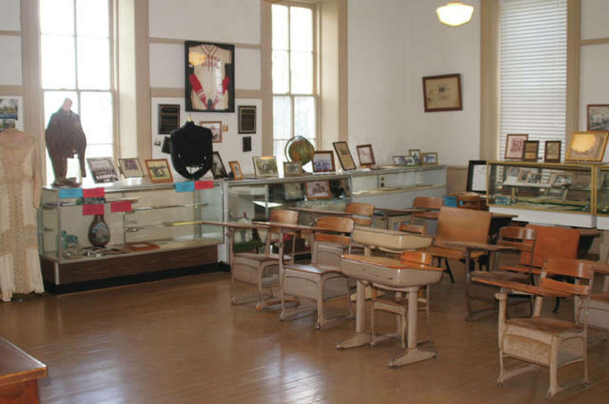 The west-facing classroom includes display cases of period memorabilia and photos.