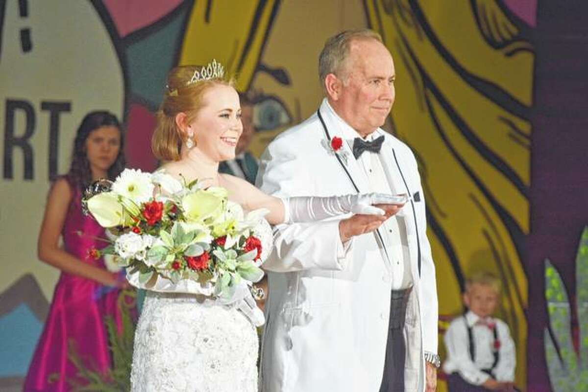 The 2017 queen of the Beaux Arts Ball, Katherine Spencer Hackett, is escorted by her father after being introduced as queen Saturday night at the Jacksonville High School Bowl. She is the daughter of Steve and Cathy Hackett of Jacksonville.