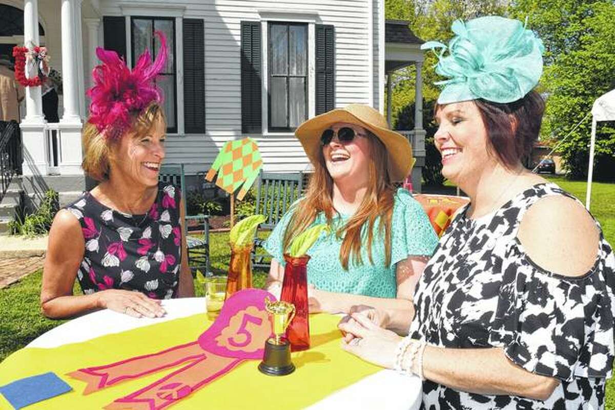 Ginny Fanning (from left), Brittany Henry and Audra Fanning Nelson share a few laughs Saturday during the Derby Day fundraiser at the historic Gov. Duncan Mansion.