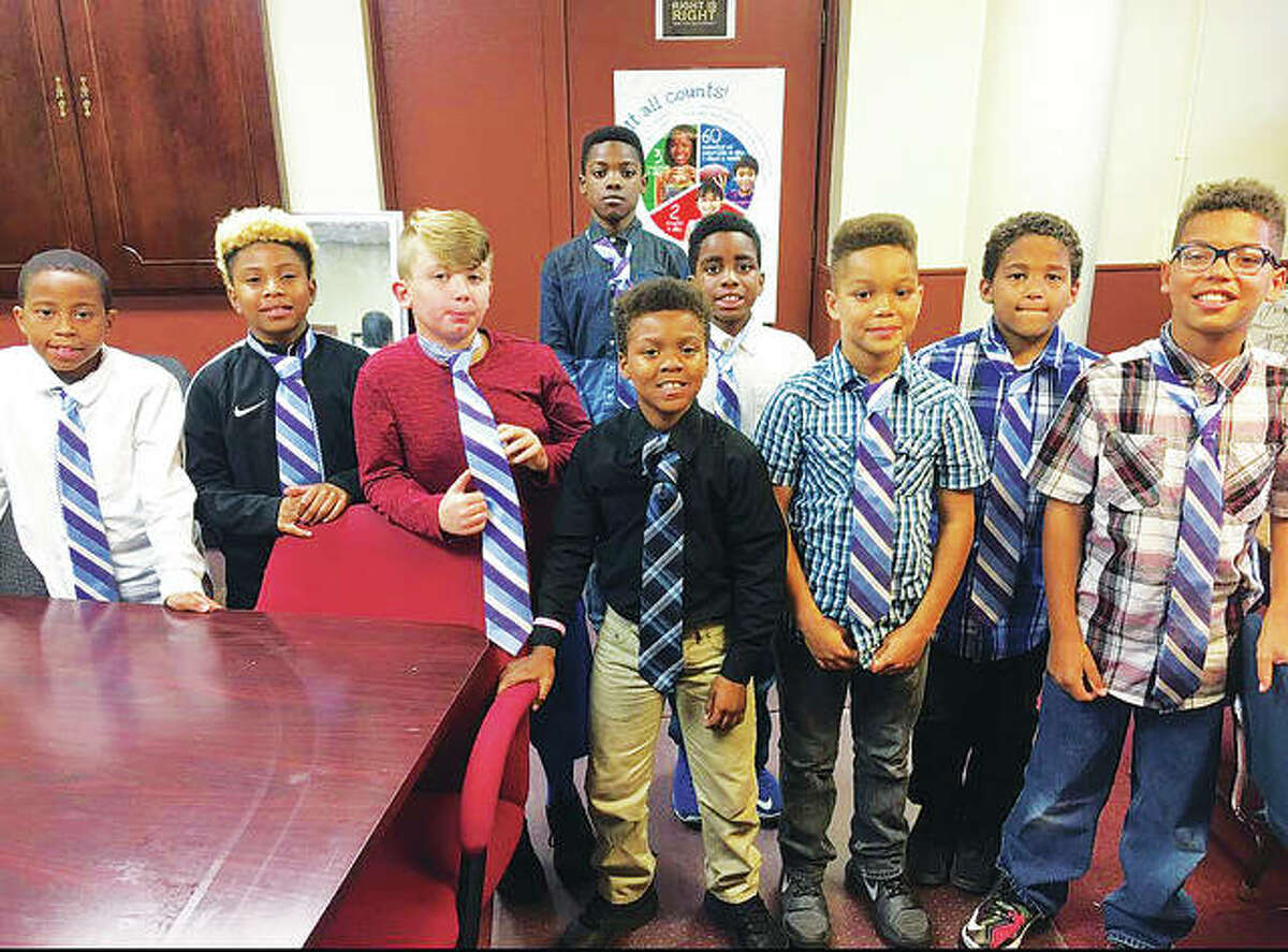 Some of the Boys and Girls Club of Alton’s Passport to Manhood program’s current members include, from left to right, first row: Sean Hood, Kameron Burnett, Evan Buddy, Malik Johnson, Elijah Stueckel, Anthony Anderson and Isaiah Stueckel; second row, Markeith Arties and Adarius Webb. In all, 20 members are enrolled in the program, all of whom are not pictured.