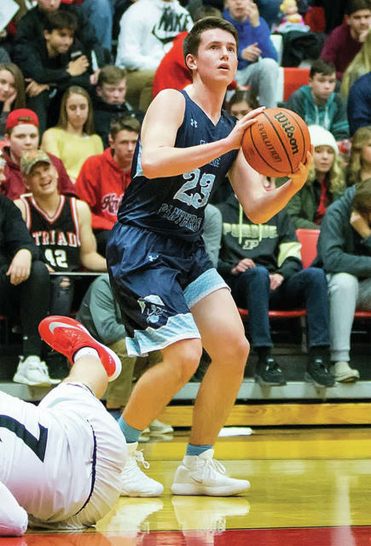 Jersey’s Cody Gibson looks to the basket after a Triad defender falls to the floor during a Panthers win Jan. 5 in Troy. The Panthers were back home Tuesday night at Havens Gym in Jerseyville and fell to Mount Vernon in overtime.