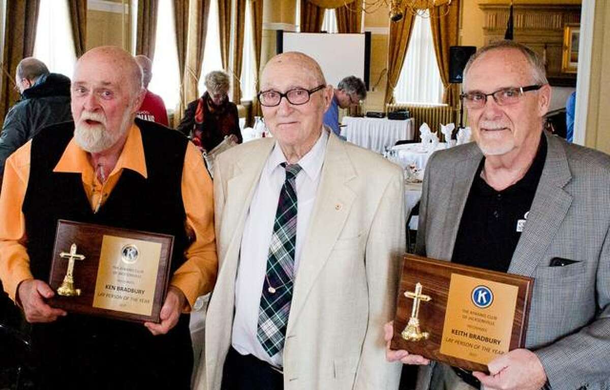 Brothers Ken (left) and Keith Bradbury (right) are this year’s recipients of the Jacksonville Kiwanis Lay Person of the Year Award. Each brother gave the award to the other without knowing they both were to receive the honor. Their father, Elmer (center), was present for the award ceremony.