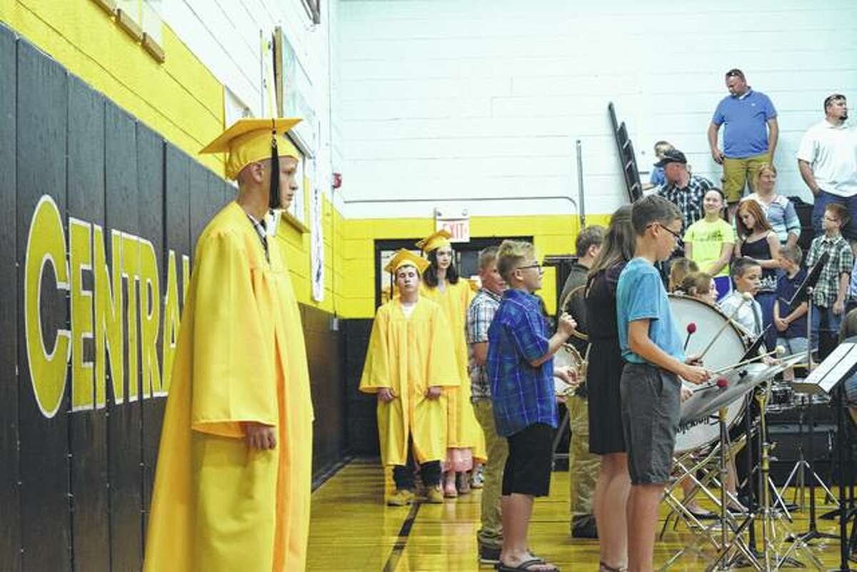 Members of the 2017 class at A-C Central Middle School file into the Pete Gutmann Memorial Gymnasium in Ashland Thursday night for graduation ceremonies.