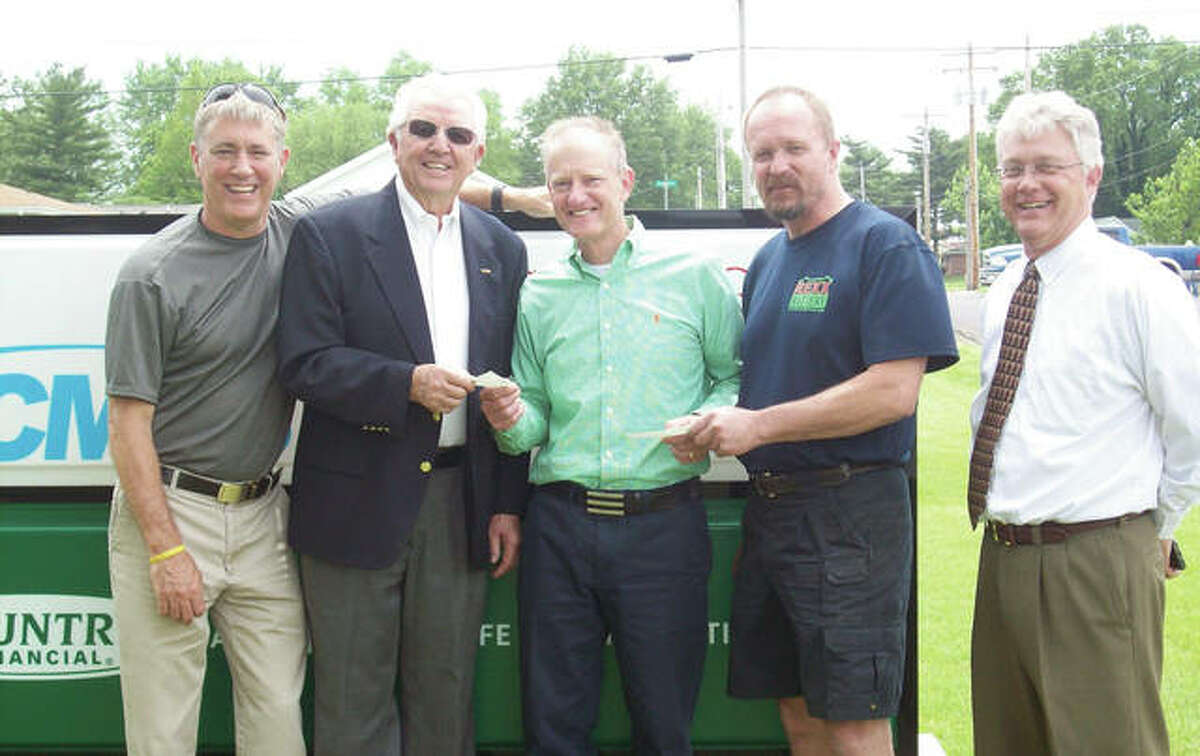 Three area organizations recently received donations representing proceeds from the West Central All-Star Basketball Classic in March at the Jacksonville High School Bowl. Gary Scott (left) of WEAI/WLDS Radio, Rick Pruitt (center) of Country Companies and Mark Whalen (right) of WEAI/WLDS presented $1,000 checks to George Murphy (second from left) of MADD Morgan County and John Hunter of Camp Courage. New Directions Warming and Cooling Center also received a $1,000 donation.