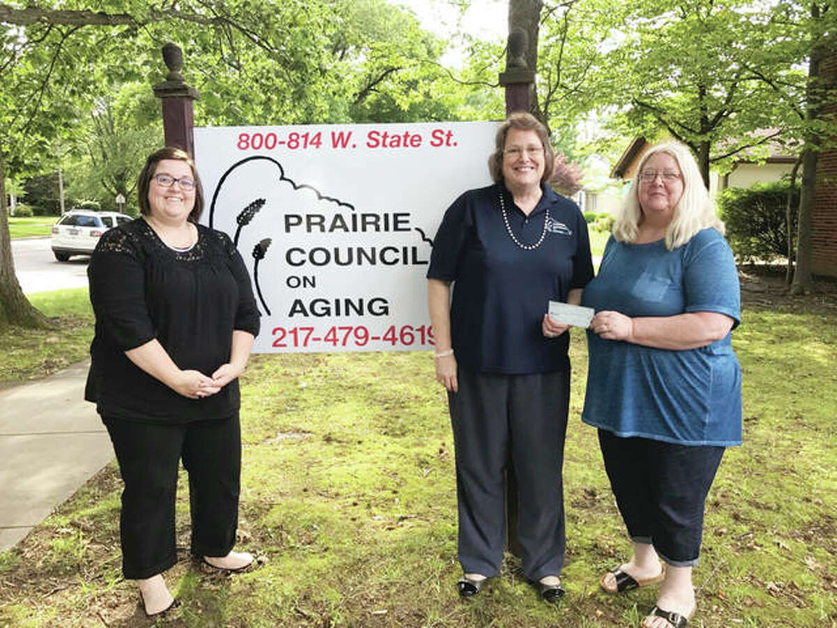 Pilot Club of Jacksonville recently donated $250 to Prairie Council on Aging for its nutrition program. Pilot member Shelle Allen (left) and Pilot Club President Patty Osborne (right) presented the check to PCOA Executive Director Nancy Thorsen.