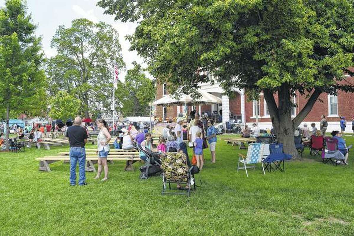 People crowd around the Cass County Courthouse on Saturday in Virginia during the 51st annual Virginia Bar-B-Que. The event ends today.