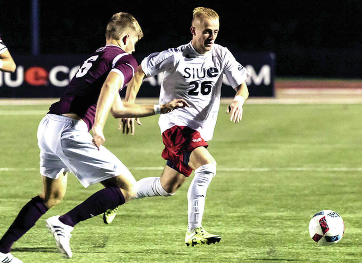 Sue’s Greg Solawa (26) dribbles the ball against Missousir State University in college soccer action Tuesday night a Korte Stadium. SIUE won 2-1.