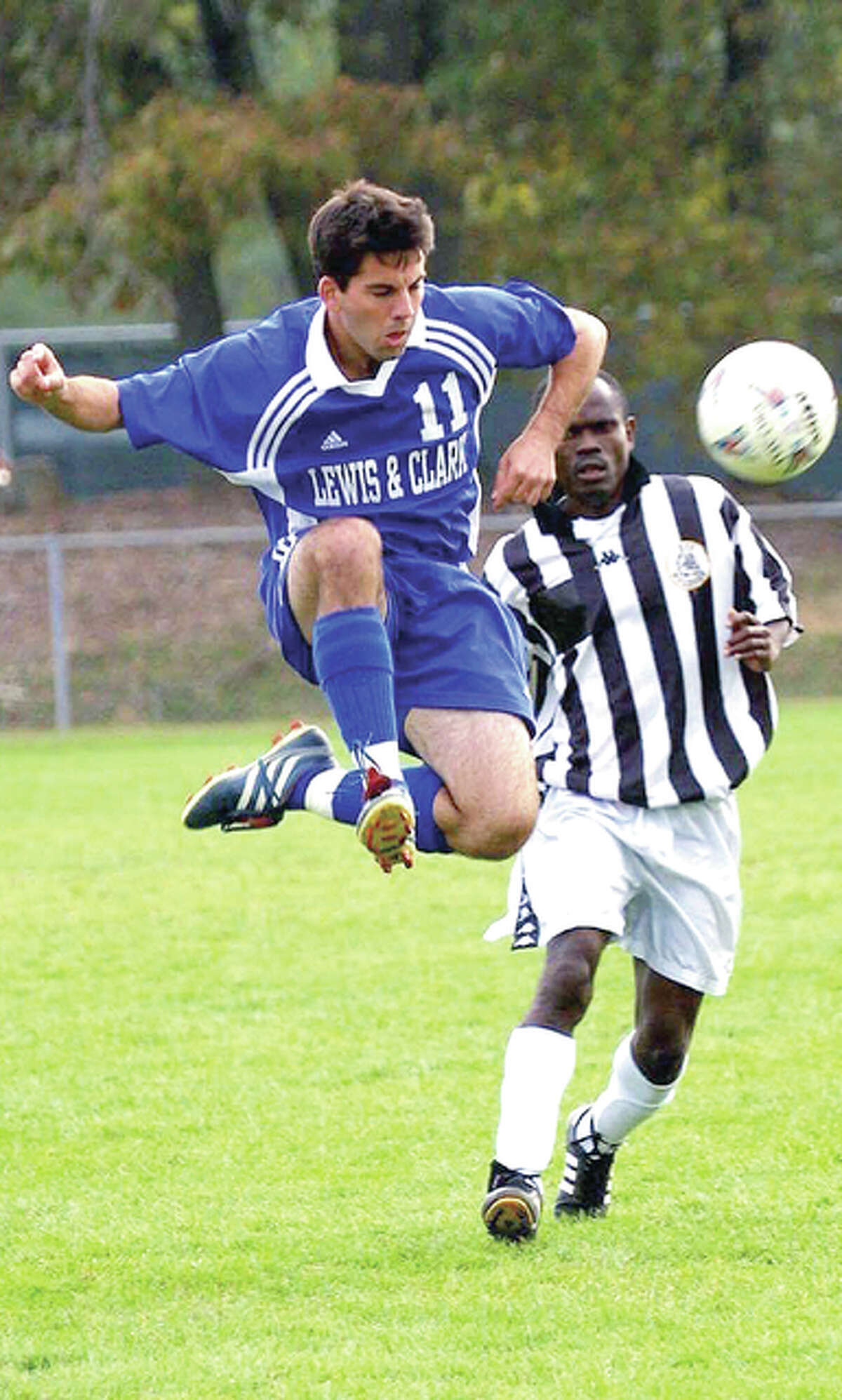 Blake Snyder (11) goes airborne to clear a ball during his days as a sweeper for the Lewis and Clark Community College soccer team.