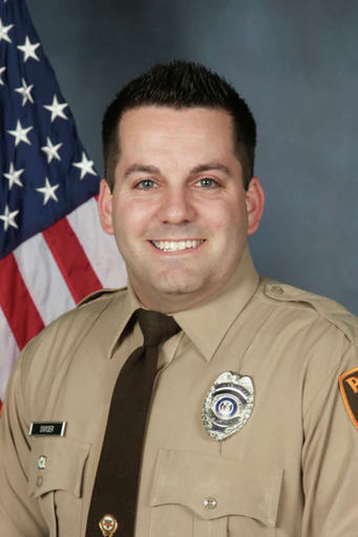 An undated photo provided by the St. Louis County Police Department shows St. Louis County Police officer Blake Snyder. Police say 33-year-old white officer Blake Snyder was fatally wounded during a pre-dawn shooting Thursday, Oct. 6, 2016, in Green Park, Mo., a small middle-class community. Police say the suspect, an 18-year-old white male, is in critical but stable condition after being shot by another officer. (St. Louis County Police Department via AP)