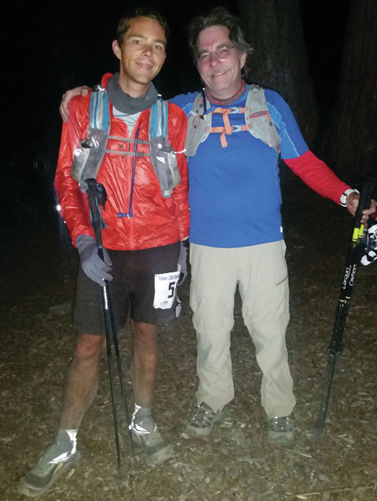 Justin Galbraith, an Alton High School graduate, poses for a photo with his father, Bill Galbraith, right after Justin finished the Tahoe-200, a 205-mile running race around Lake Tahoe. He completed the race is 85 hours with very little sleep.