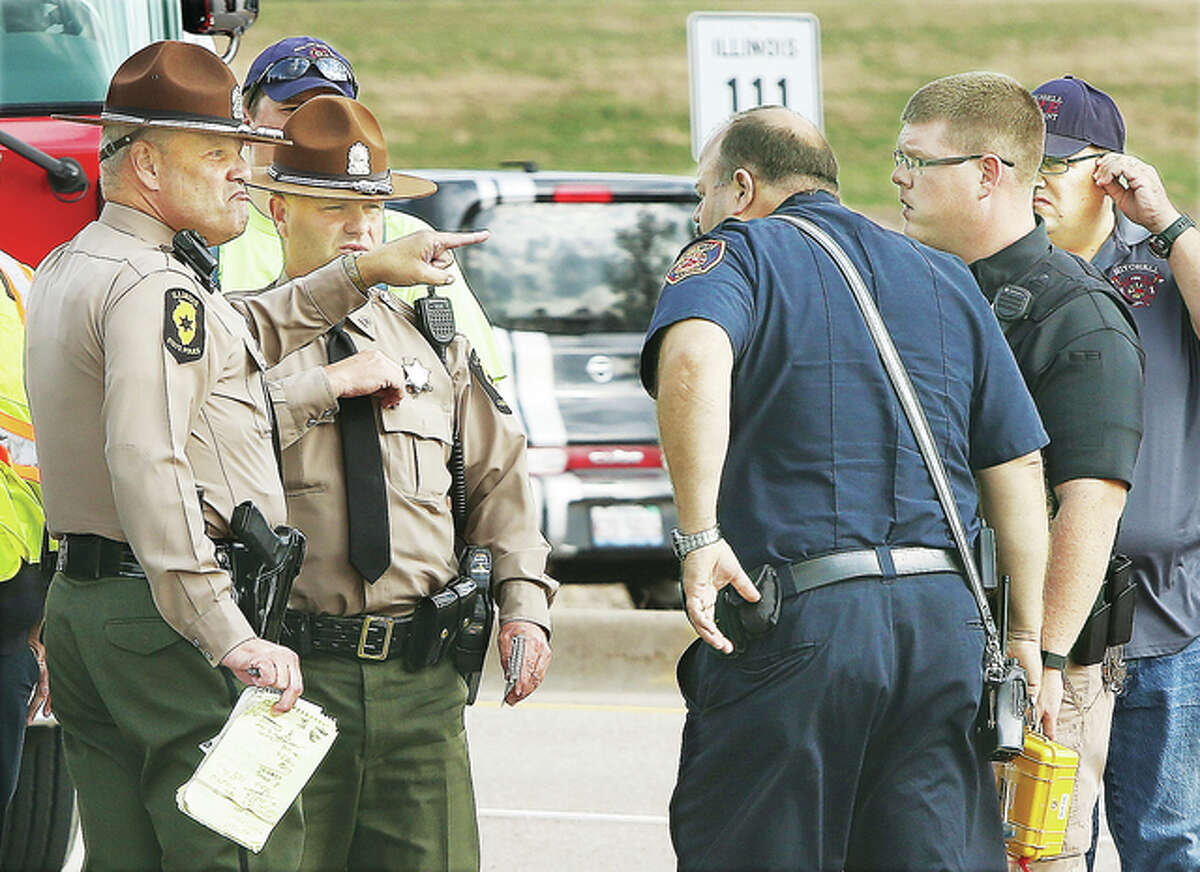 Several injured in ambulance, car crash