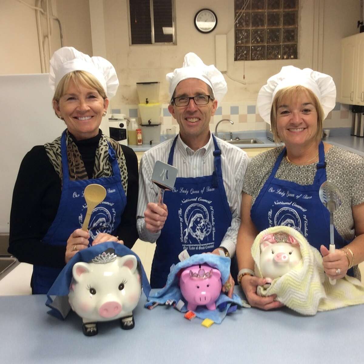 Getting ready for the Smorgasbord Dinner and Craft Bazaar on Sunday, Dec. 4 at Our Lady Queen of Peace are committee chairmen, from left, Becky Sulsberger, Dennis Gvillo and Stephanie Gvillo.