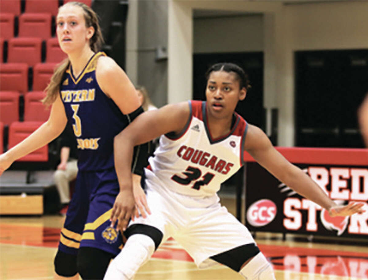 SIUE’s Donshel Beck (right), shown working for position on Western Illinois’ Olivia Braun in a Nov. 27 game at Vadalabene Center in Edwardsville, scored a game-high 27 points in the Cougars’ 78-68 loss to host Stetson on Monday at the 29th annual Hatter Classic in DeLand, Fla.