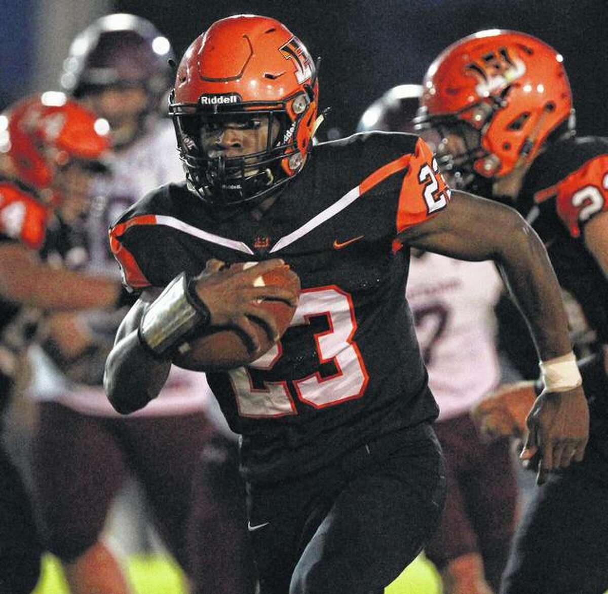 Beardstown’s Pascal Guilavogui picks up yardage in a game against Mendon Unity Friday night in Beardstown.