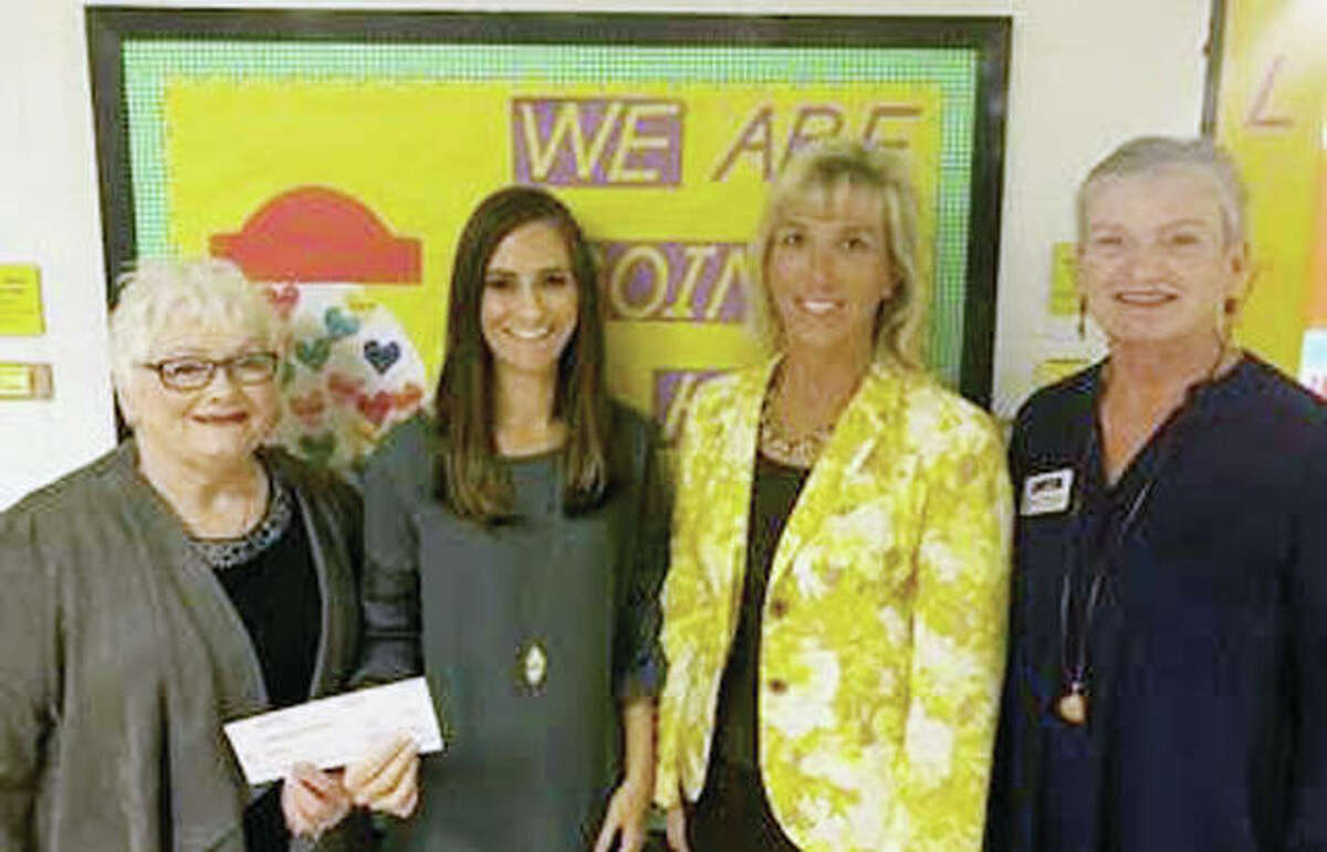 The Illinois Retired Teachers Association Foundation recently awarded $36,500 in grant money to several public school educators statewide, including Trista Barrett (second from left), a speech teacher with A-C Central Community Unit School District 262, Virginia CUSD 64 and Chandlerville Area 4. On hand for the check presentation were Sue Taylor (left), A-C Central Elementary School Principal Deborah Rogers (second from right) and IRTAF representative Donna Sargent. The grant funds will be used to help diagnose and treat communication impairments that hinder academic and social success.
