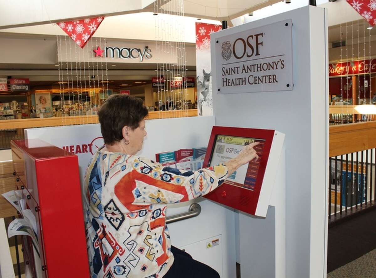 Marti Keller of Alton uses the OSF Saint Anthony’s Heart Check Station at the Alton Square Mall.