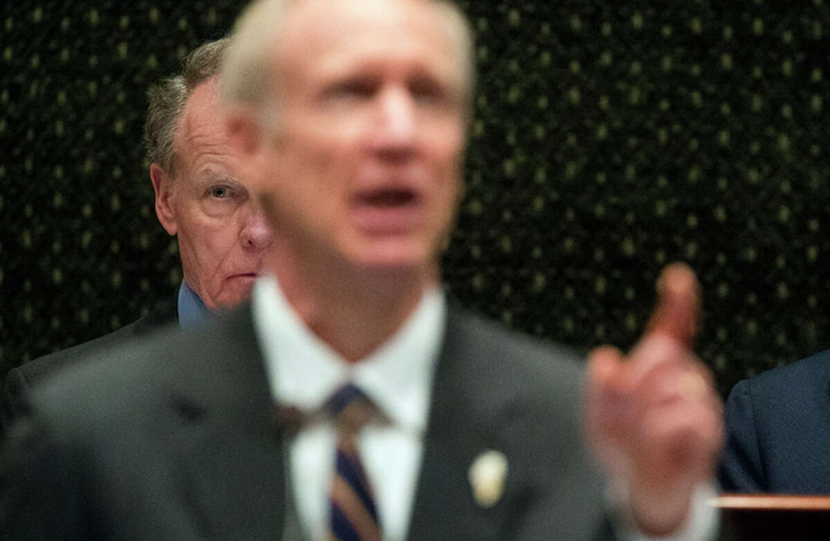 Illinois House Speaker Michael Madigan, D-Chicago, listens as Illinois Gov. Bruce Rauner delivers his State of the State address in the Illinois House chamber Wednesday, Jan. 25, 2017 in Springfield, Ill. Rauner called on lawmakers to work with him to resolve Illinois’ budget crisis, saying both parties agree something needs to change.