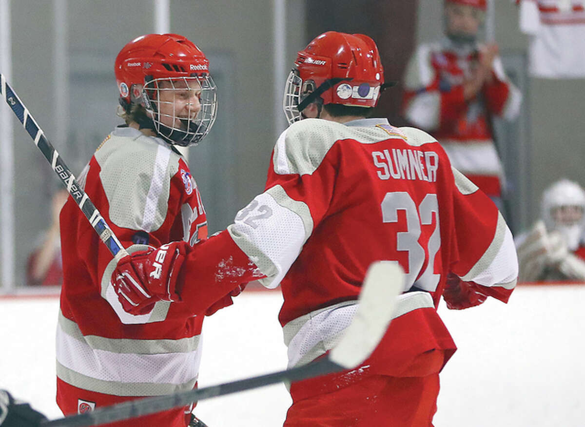 Alton’s Bryce Simon, left, and Jack Sumner combined for a pair of goals in Thursday’s late-night 3-1 victory over Belleville at the East Alton Ice Arena. Simon scored his 18th and 19th goals of the season from assists by Sumner, who had notched 10 assists this season. They are pictured celebrating a Simon goal earlier this season.