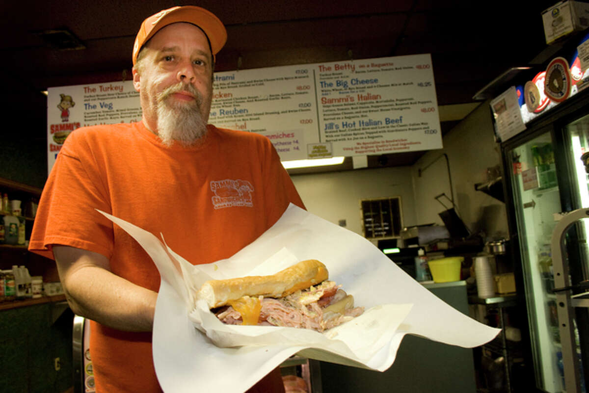 Scott Yarbrough serves up his signature “Pig on a Wing” sandwich at Sammi’s Sandwiches. The eatery, formerly S&S Sandwiches, was recently renamed after his 2-year-old daughter, and also has a second location recently opened on East Broadway.