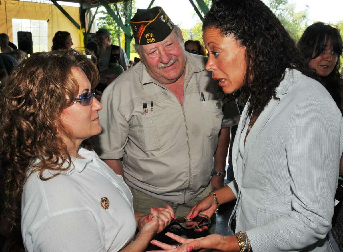 New York state's first lady Michelle Paterson, right, speaks with members of the Ballston Spa VFW, Kathy Desfosse, president of the Lady's Auxillary, and Bob Stark, post commander, in Saratoga Springs Saturday. The event was held to raise money for the state's first homeless vets house for females, the Guardian House Project for Homeless Women Veterans in Ballston Spa. (John Carl D'Annibale / Times Union)