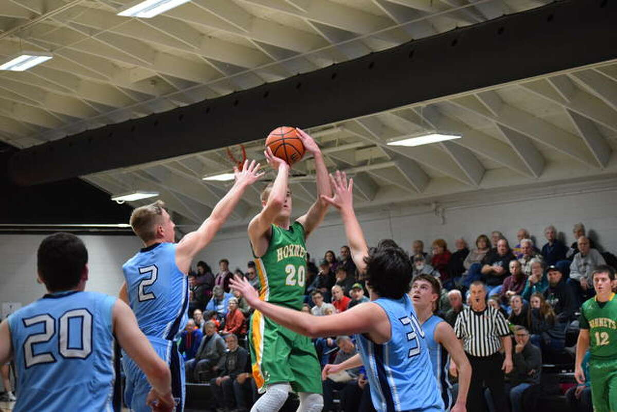 Brown County’s Nathan Hendricker attempts a shot against Triopia Saturday.