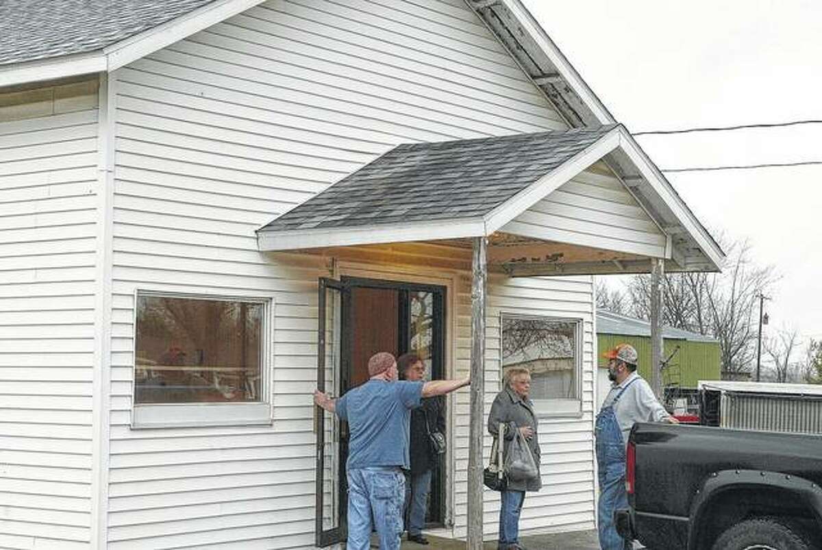 Members of the Nortonville Community Club discuss potential fundraisers outside the village’s hall.