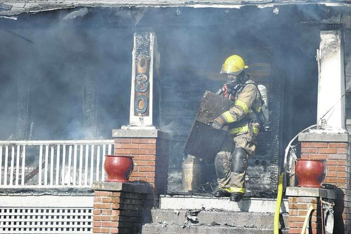 Jacksonville firefighters work Thursday to put out a fire at 2030 Baldwin Road. The fire was reported about noon at the residence.