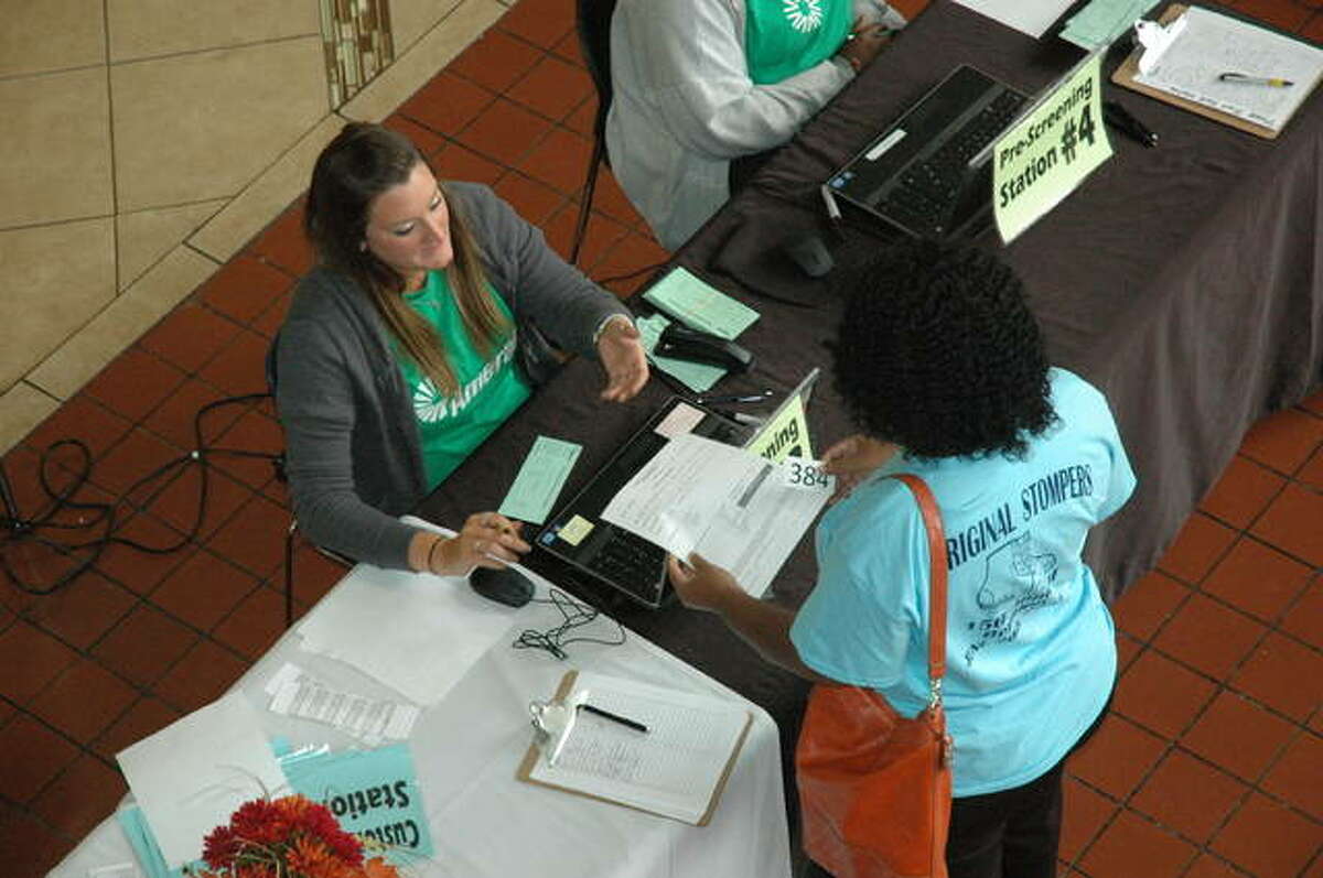 An Ameren representative speaks with a customer at last year’s customer outreach event in East St. Louis.
