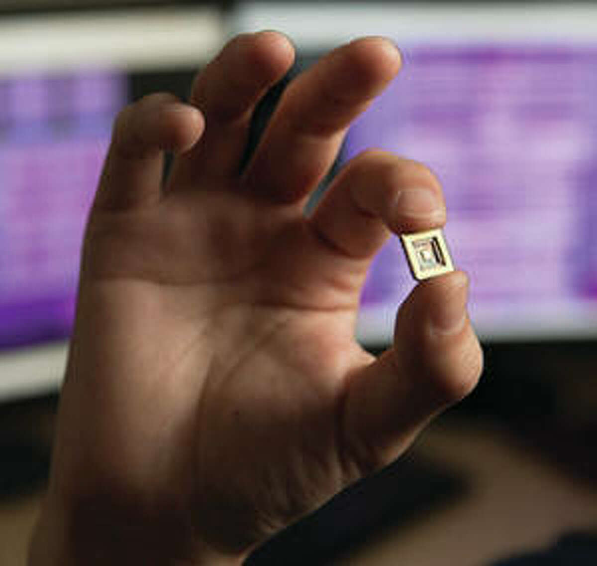 A close-up of one of the microchips Professor George Engel has created demonstrates its size.