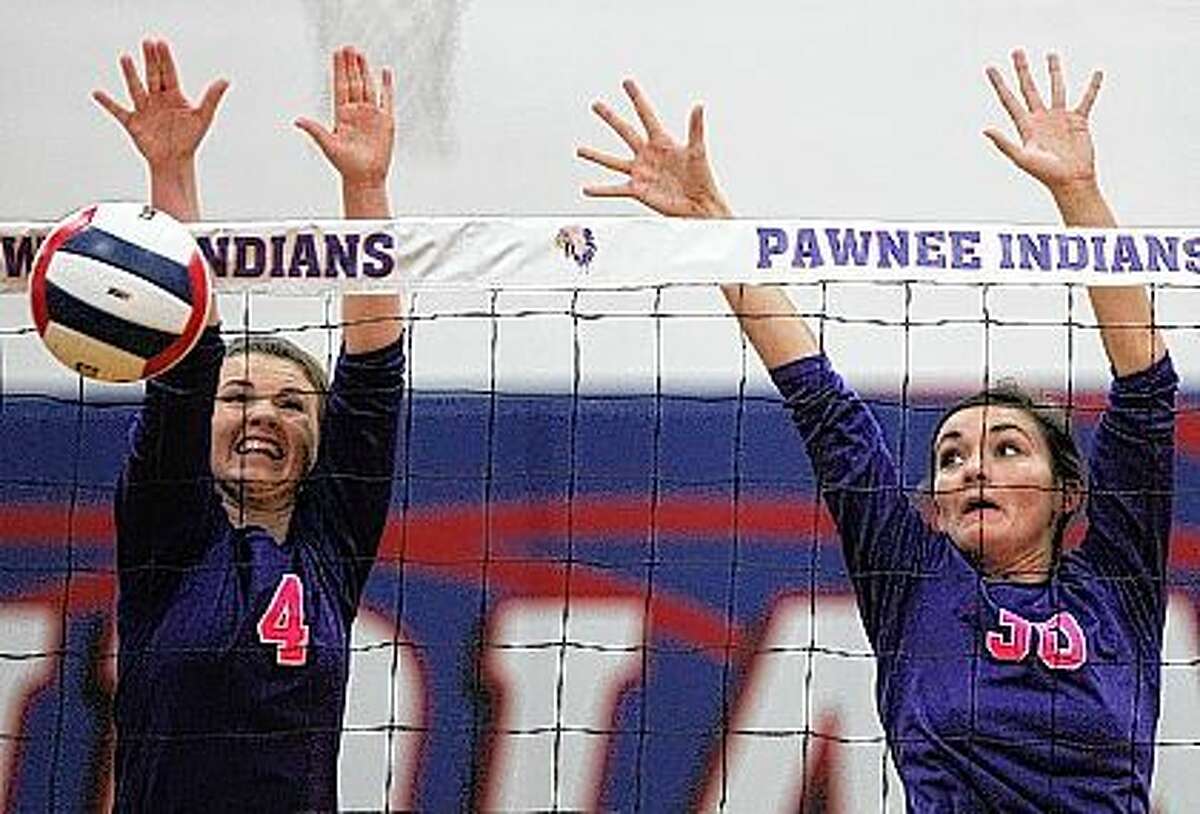 Routt’s Maddie Nelson (left) and Marie Langdon go up for a block during a match against Raymond Lincolnwood in the semifinals of the Pawnee Sectionals Tuesday night.