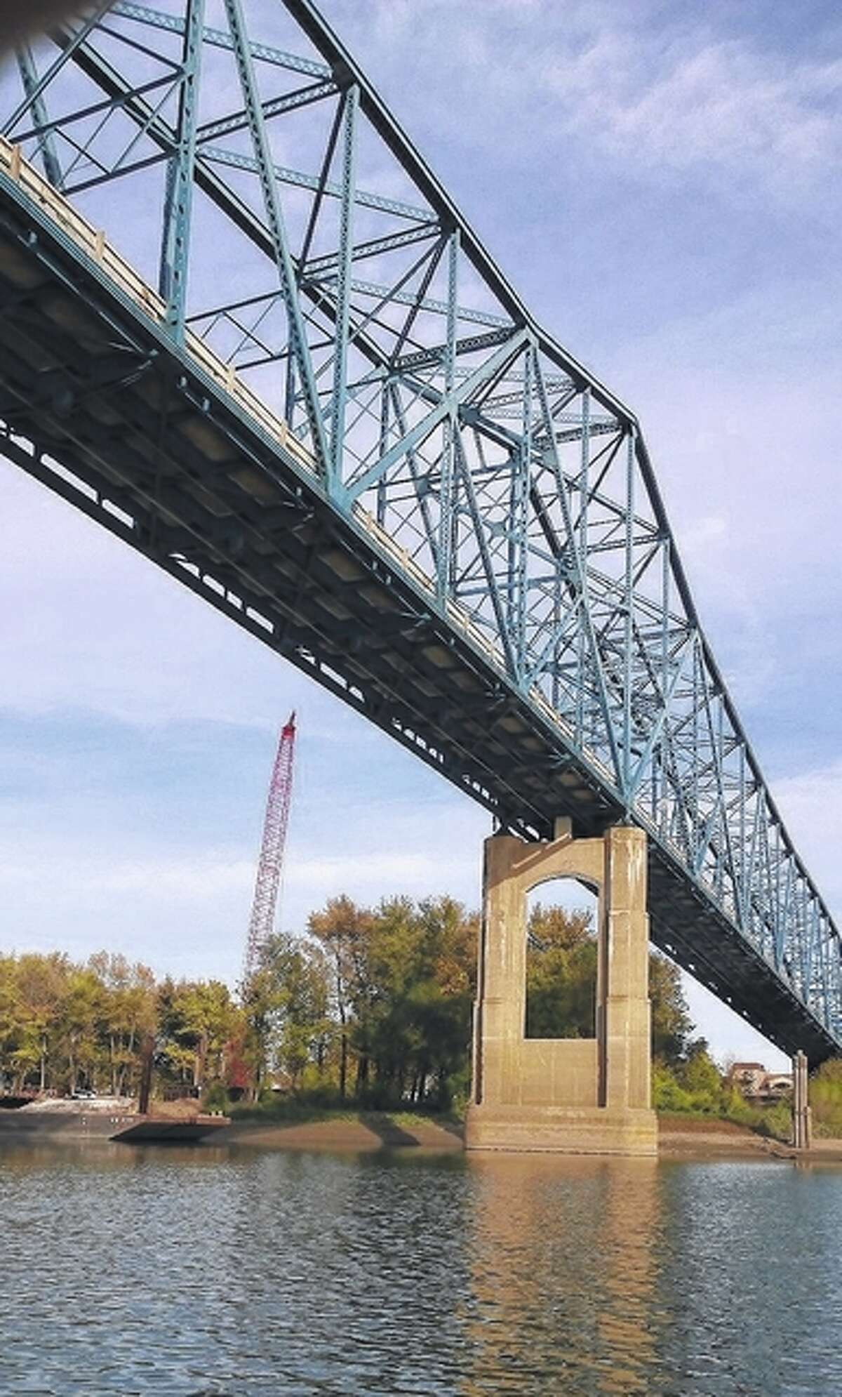 Photo courtesy of Jerry Stocker Construction is under way on the nine piers that will support the new Illinois Route 104 bridge over the Illinois River at Meredosia. The 1936 bridge, looming in the foreground, will be demolished once the new bridge is completed in fall 2018.