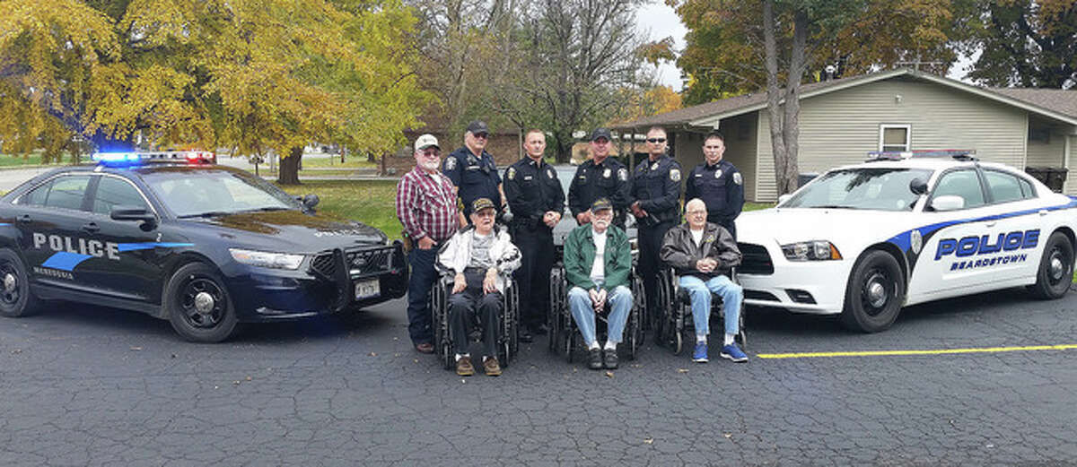 Photo courtesy of Debbie Carnes Army veteran Howard Johnson (front row, from left) and Navy veterans Kenney Kunkel and Wayne “Bob” Kehl join with Navy veteran Phillip Williams (back row, from left), Meredosia Patrolman Richard Pulling, Meredosia Patrolman Jarred Hester, Meredosia Police Chief Curtis Williams, Beardstown Police Chief Dustin Clark and Beardstown Patrolman Chase Fox following a Veterans Day lunch. Pulling is a Navy and Air National Guard veteran, Hester is a Marine Corps veteran, Williams and Clark are Army veterans and Fox is a Marine Corps veteran.