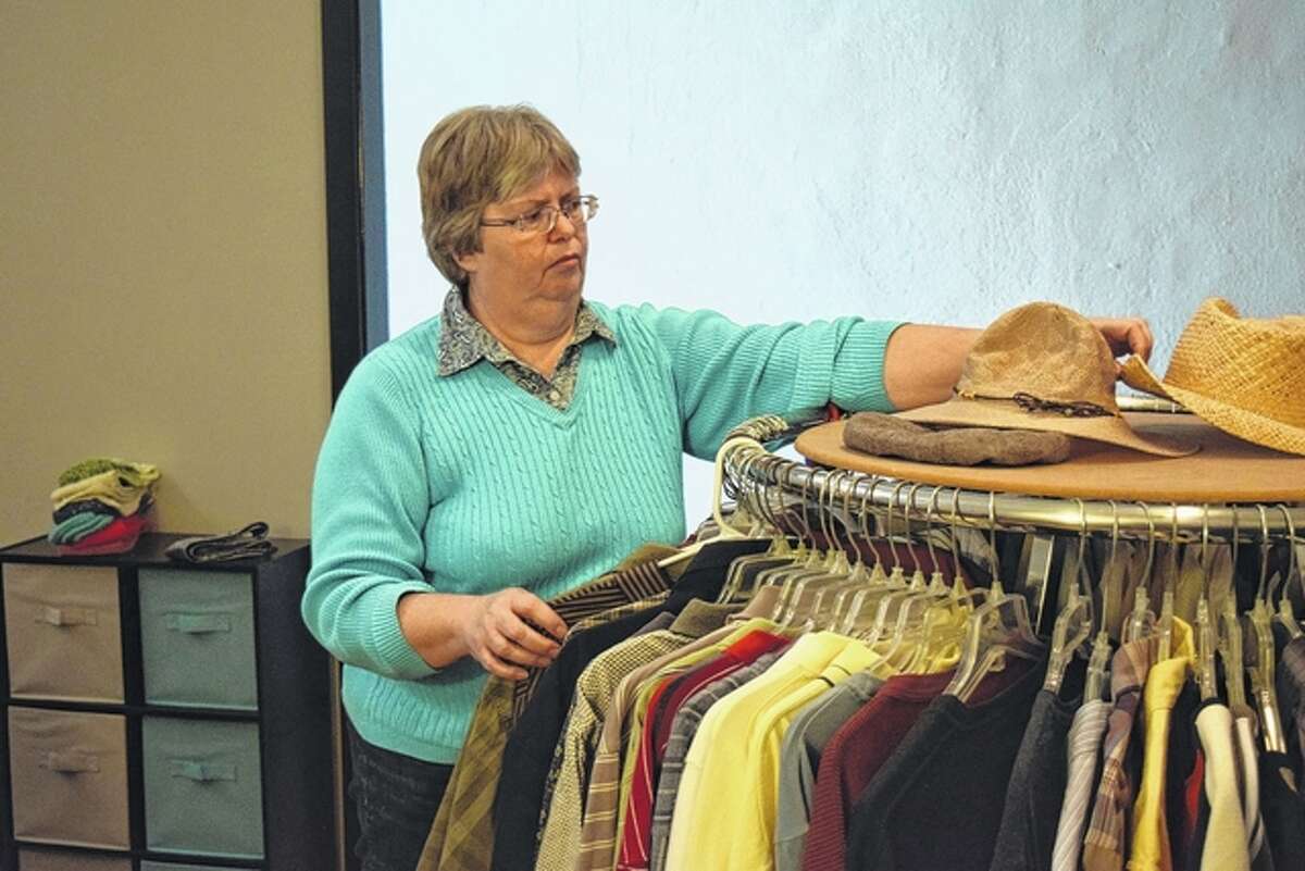 Rita Briggs, co-manager of Grace Place Thrift Store and Ministry Center at 29 S. Central Park, works at the store Friday preparing for today’s opening.